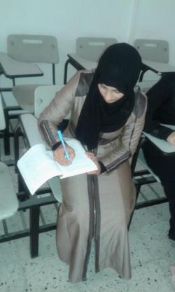 Nadia at a desk at her university