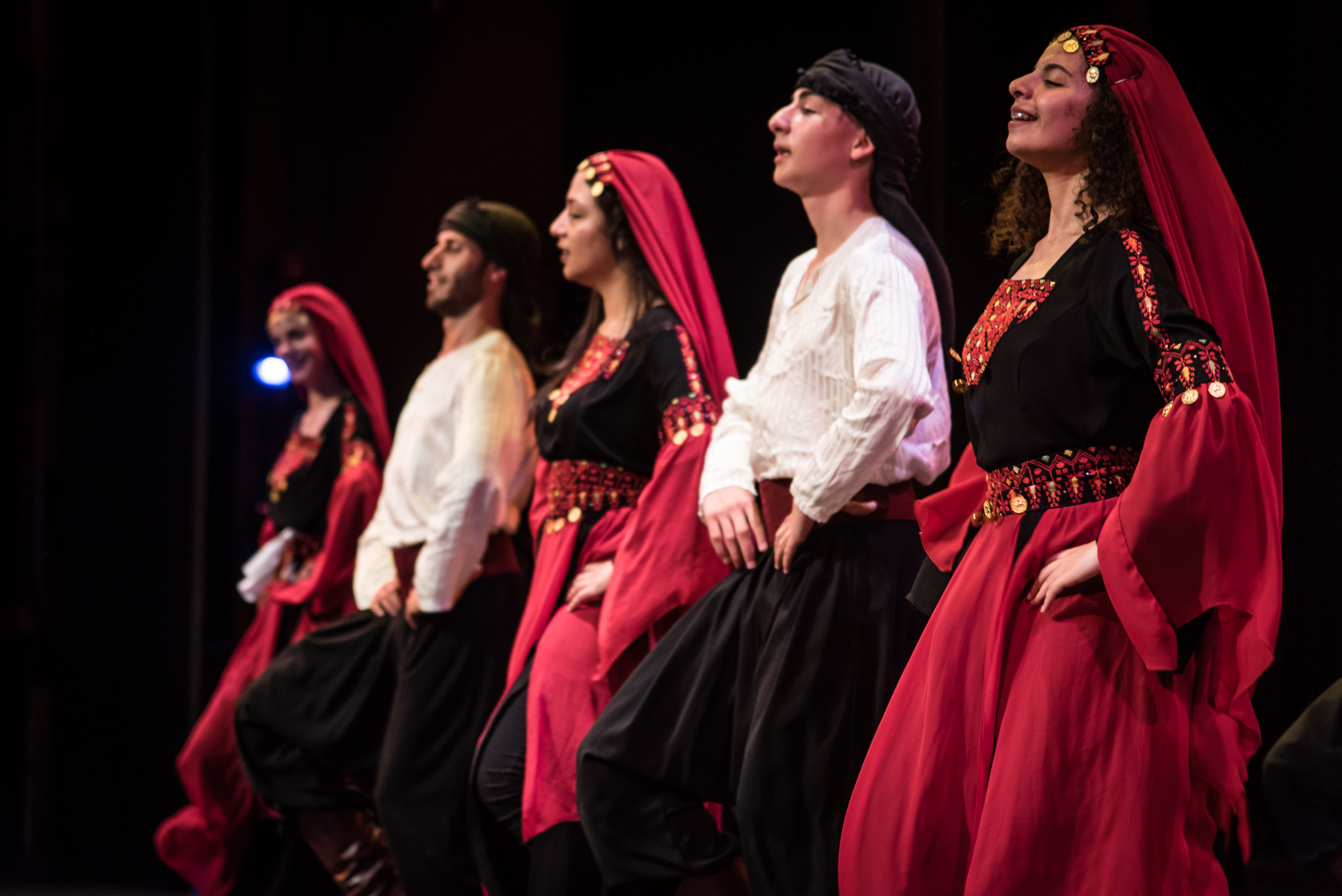 Shoruq dancers on stage in Oakland, California in their traditional costumes
